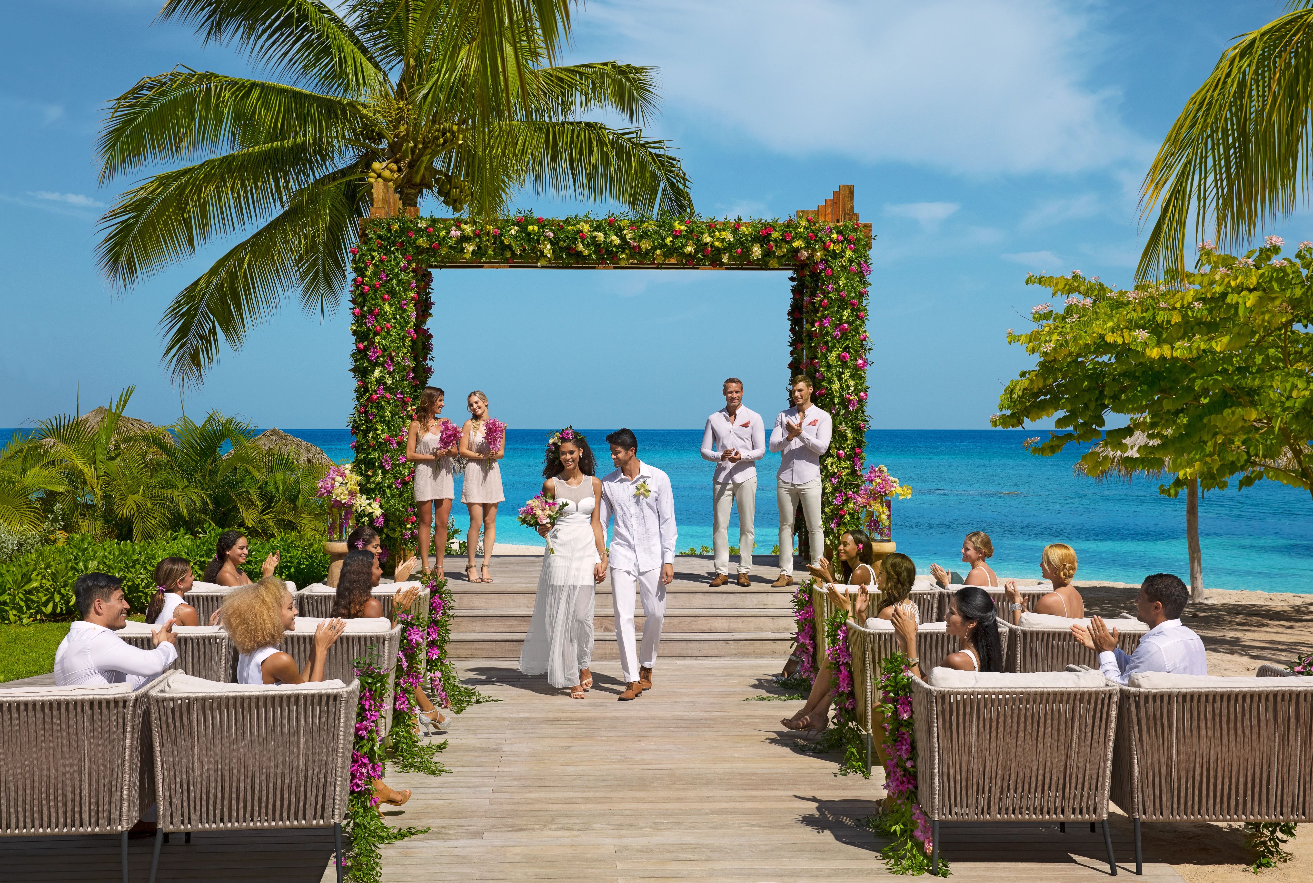 wedding with floral arch backdrop
