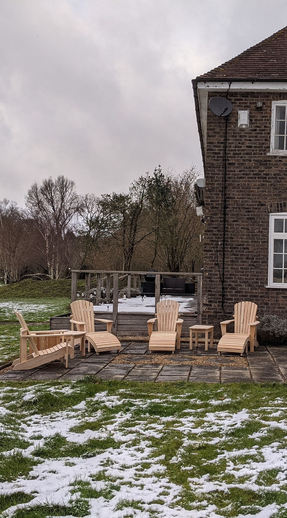 Four Adirondack Chairs in an English garden