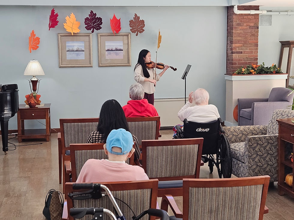 Iris playing the violin at a retirement home