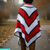 Video of Autumn Ember red wool crochet poncho worn on an autumn woodland walk