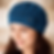 Woman wearing Azure Bloom crochet beanie with handmade flower detail in blue