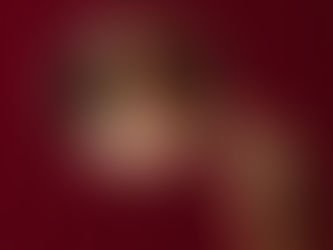 image of a woman's throat being reflected through a hand mirror