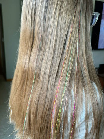 Blonde hair with sparkling silver hair tinsel for a corporate event.