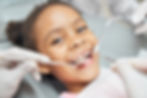 kids makes smile during dental care
