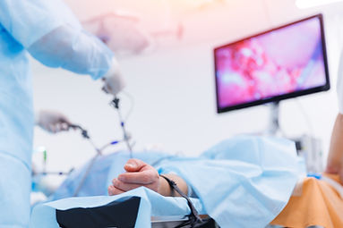 Surgery working with modern laparoscopic equipment camera and lcd screen, sunlight. Operat