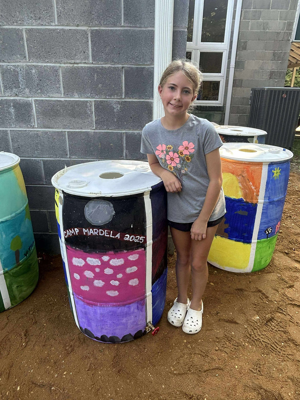Camper Reagen with painted rain barrel made at The Wild camp