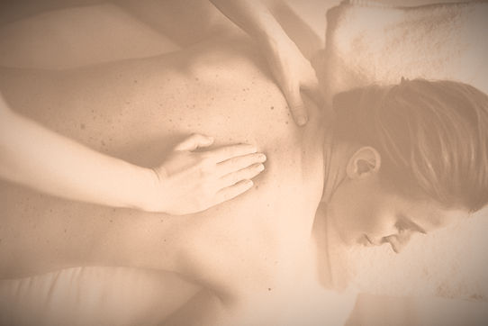 white hand on a freckled white back in sepia color