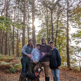 Talia Zamora and her family in the woods