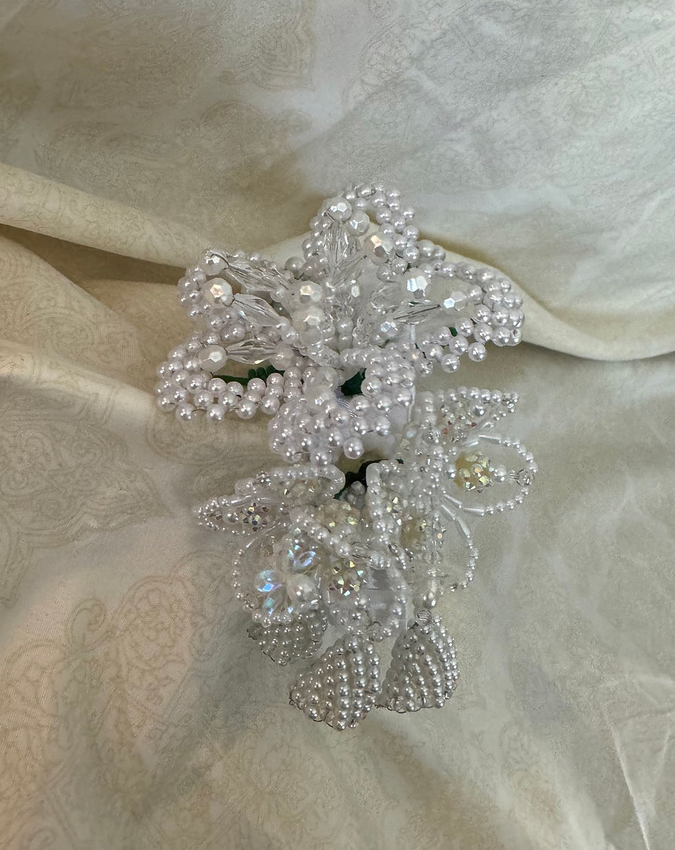 A white multi flower headband / vincha with beads & crystals
