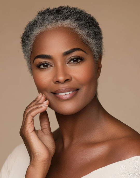 elegant-portrait-black-woman-with-short-natural-gray-hair-radiant-smile-neutral-background.jpg
