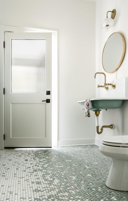 Pool guest bath with wall mounted farm sink, fluted privacy glass and hand laid custom penny tile mosaic.