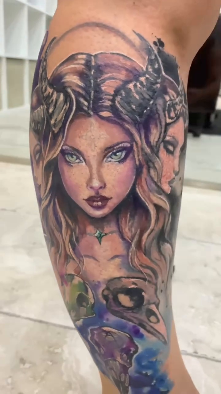 Fresh Hecate cover-up on Chusi's leg with green eyes, violet tones and watercolour