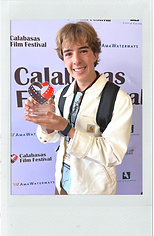 Meet Collin heading - Collin Nelson - Director holding is award from the Calabasas film festival - polaroid