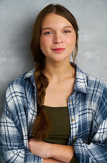 Lauren Elizabeth Pye, youth actor, singer, equestrian. half smile, blue background braid