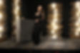 Lauren Elizabeth Pye singing on stage in all black
