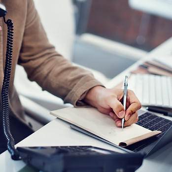 closeup-hand-writing-note-while-phone.jpg
