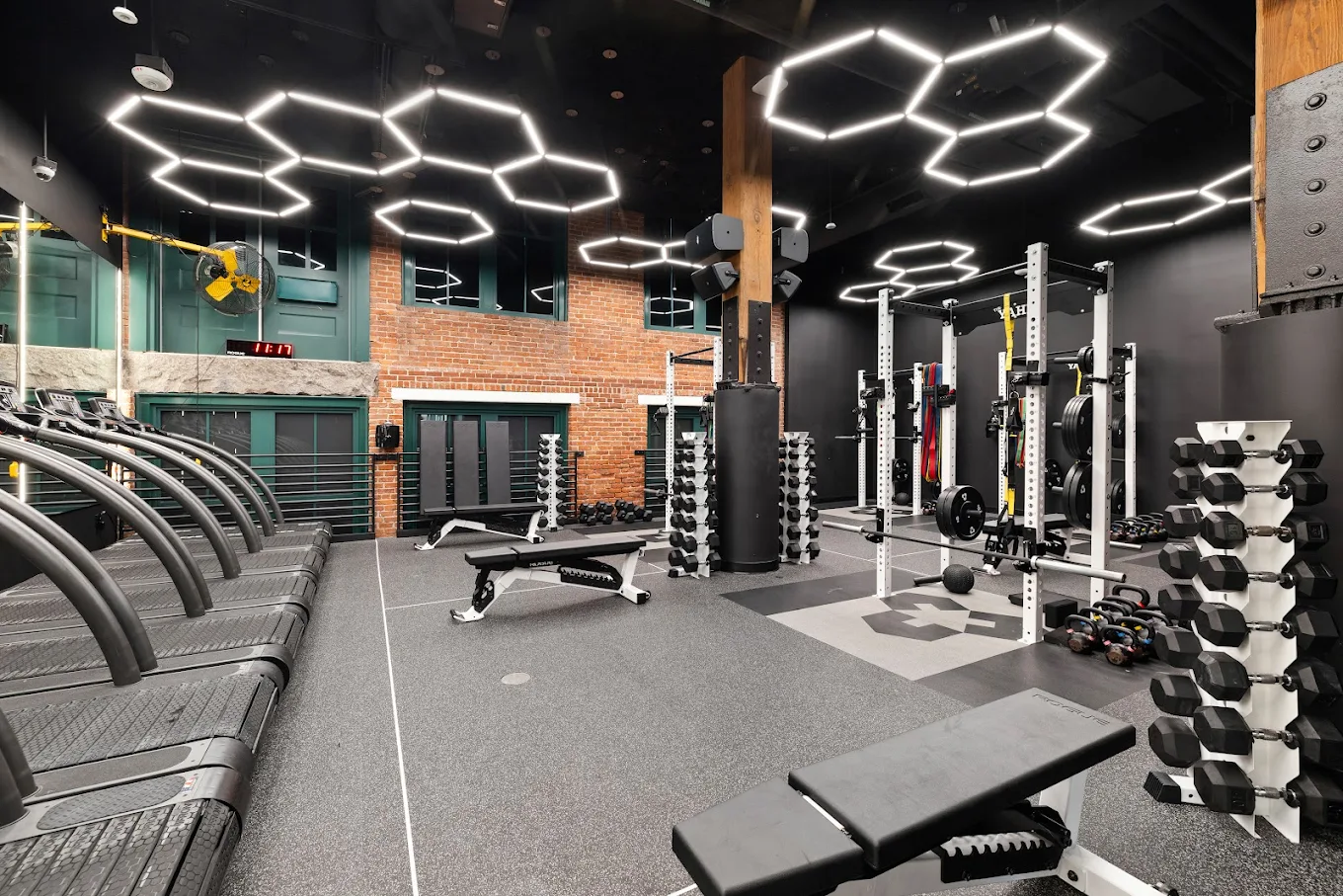 Strength and conditioning workout at Backyard Boston in a modern warehouse-style studio.