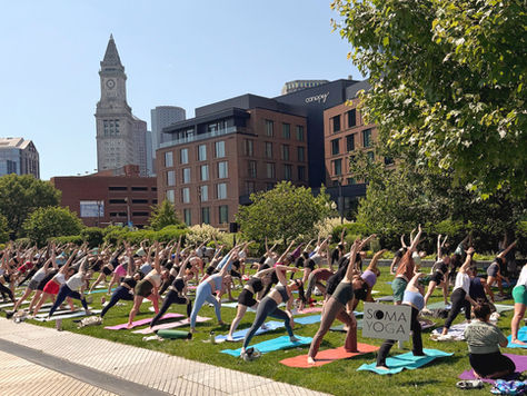 An outdoor yoga class in Boston, MA