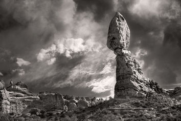 A black and white photograph of Balanced Rock in Arches National Park, Utah