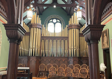 Our organ pipes and baby grand piano.