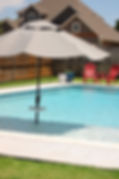 Sparkling clean backyard pool serviced by pH Perfect Pools in The Woodlands TX