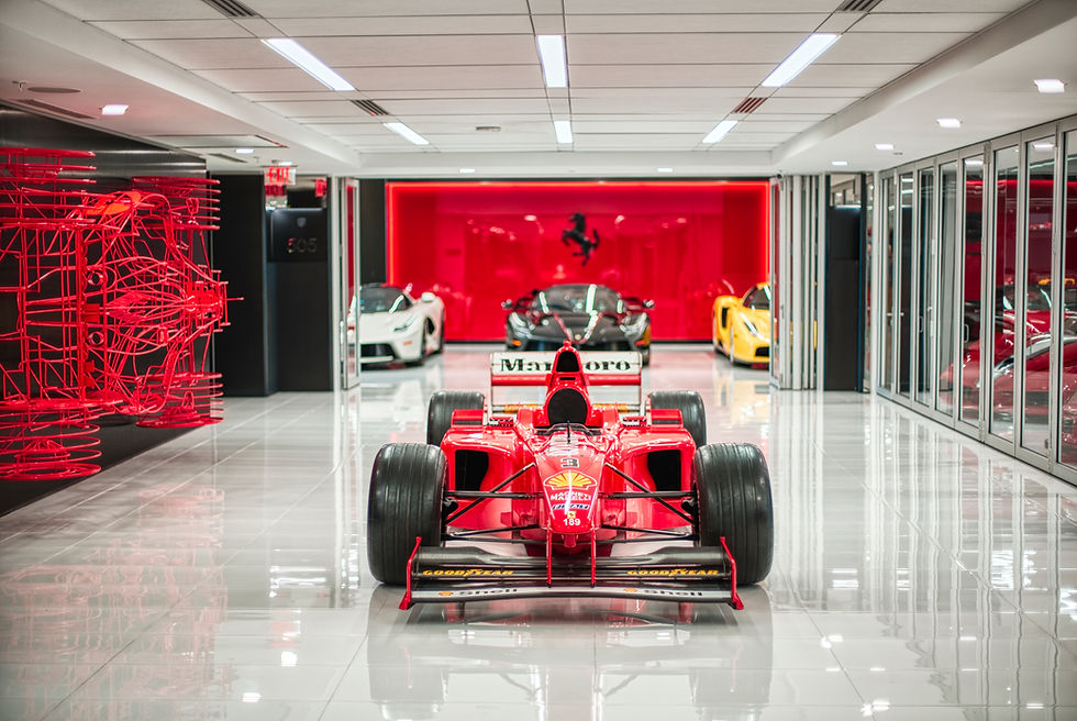 Sell your car with video & photos: red Ferrari F1 car in showroom