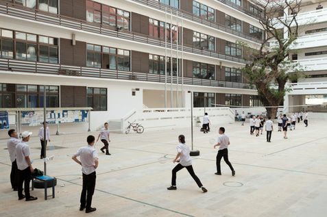 Students play badminton in the courtyard of Phiawath Complete Secondary School in Vientiane, a newly built school fully supported by the Chinese government as part of ongoing education cooperation between Laos and China. Laos, 2024.