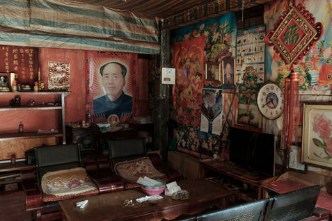 A portrait of Mao Zedong inside a home in Phongsaly town. Once part of the independent Tai Lue kingdom of Xishuangbanna, Phongsaly was incorporated into French Indochina at the end of the 19th century. Today, most people in Phongsaly town belong to the Haw ethnic group, many of whom speak Chinese, reflecting the region's historical ties with neighboring China. Laos, April 2022.