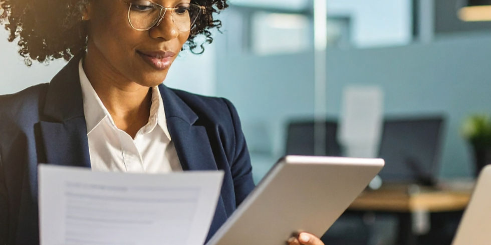 A woman writing or reviewing content at a desk_edited.jpg