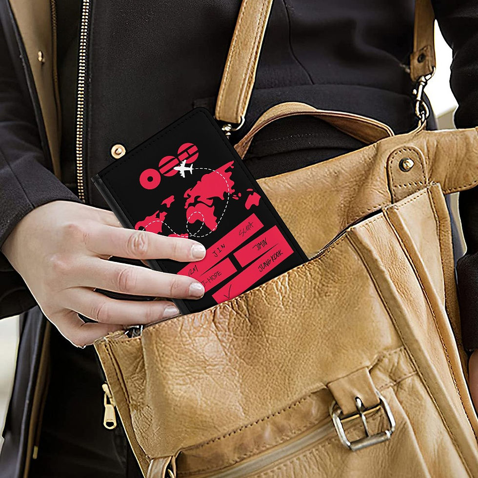 Woman holding black passport holder design BTS worldtour 2026