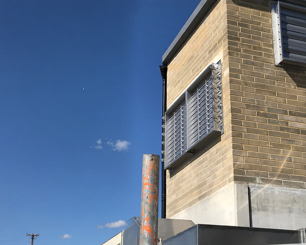 An air damper on the side of a building