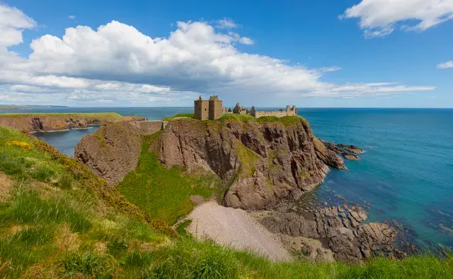 The historic ruins of Dunnottar Castle perched on rocky coastal cliffs in Aberdeenshire.