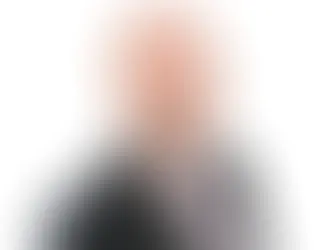 Professional headshot of Chris Plumley, Public Sector Real Estate Partner at Trowers & Hamlins, wearing a suit and glasses.