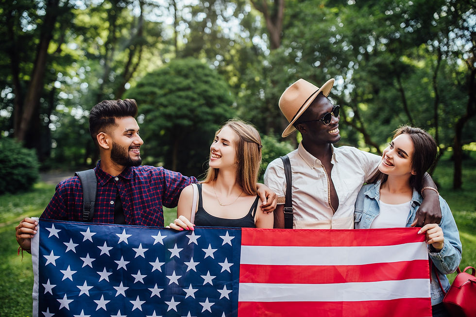 happy-four-students-relaxing-nature-with-american-flag-celebrating-4th-july_3562x2374.jpeg