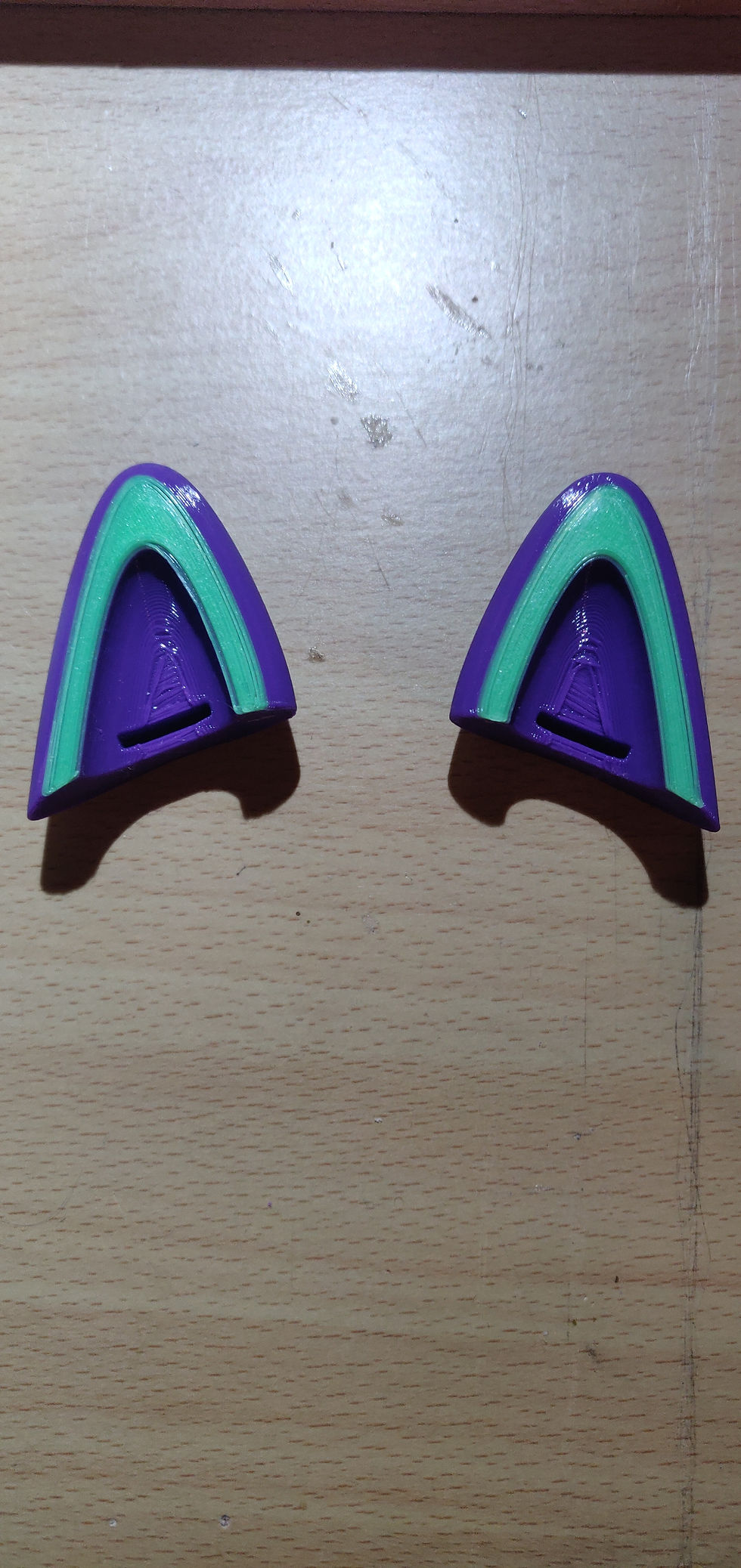 cat ears side by side on desk