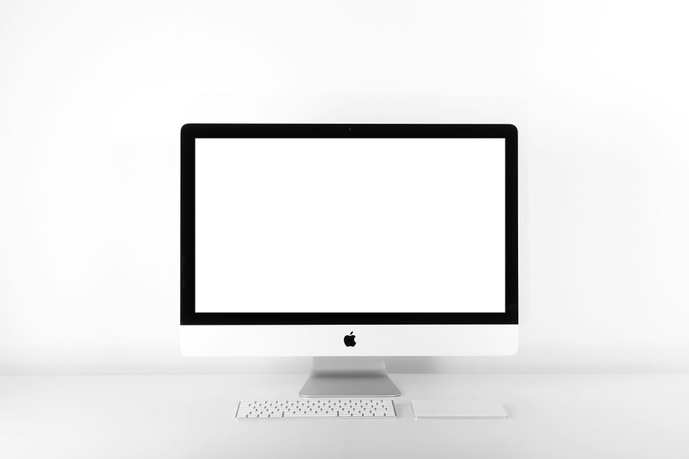 An Apple iMac sitting on a desk.