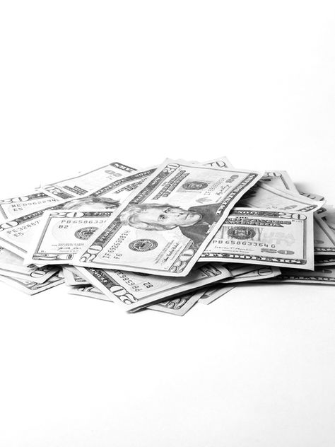 Twenty-dollar bills in a pile. 