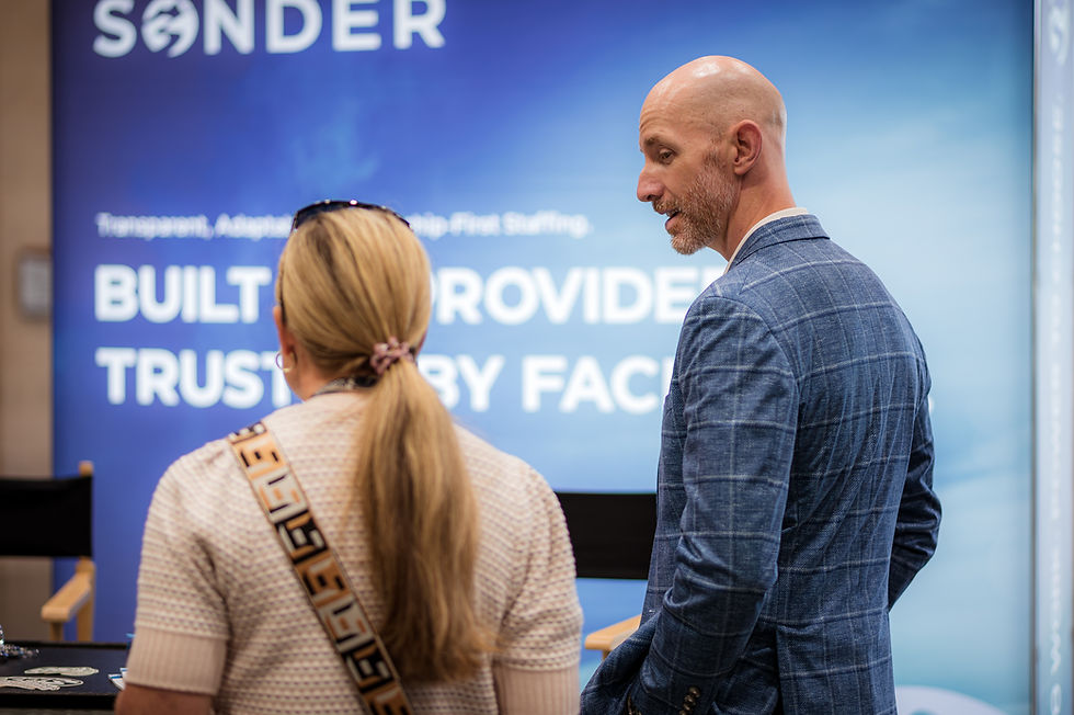 Lee Coates talking a client