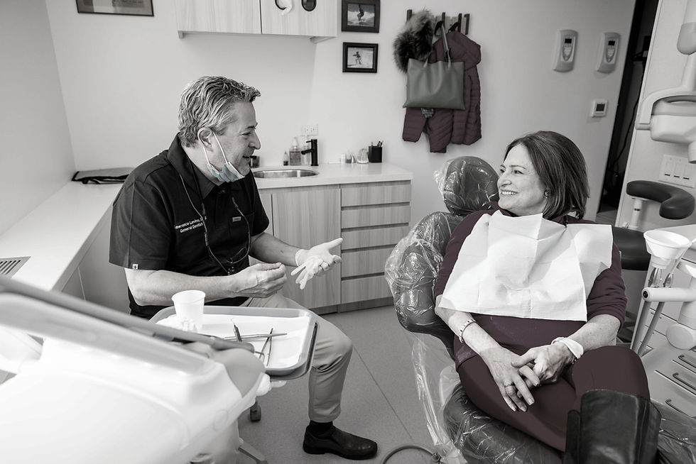 Madison Dental dentist reviewing personalized treatment plan while patient relaxes comfortably during informative consultation appointment inside.