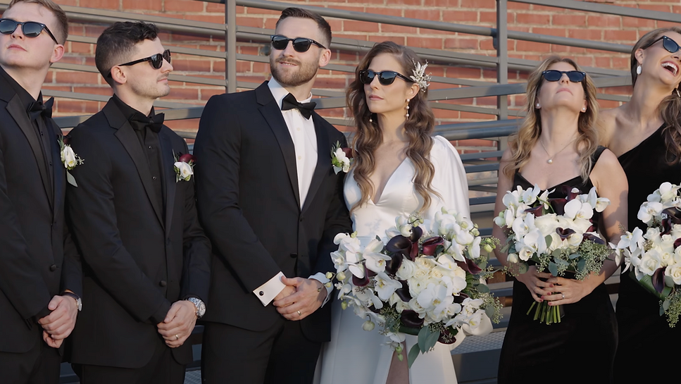 bride and groom with wedding party