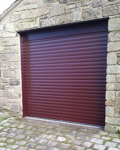 Brown garage door professionally fitted to a home