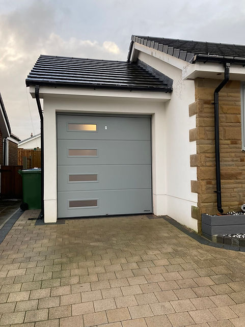 Coloured garage door professionally installed by Allandor