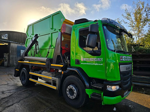 green UK Metal Recycling Ltd with skip on back