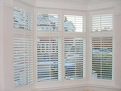white window shutters Q M Interiors