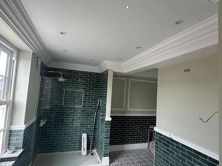 tiled room with decorative coving