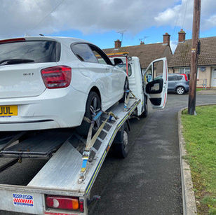 white car being recovered