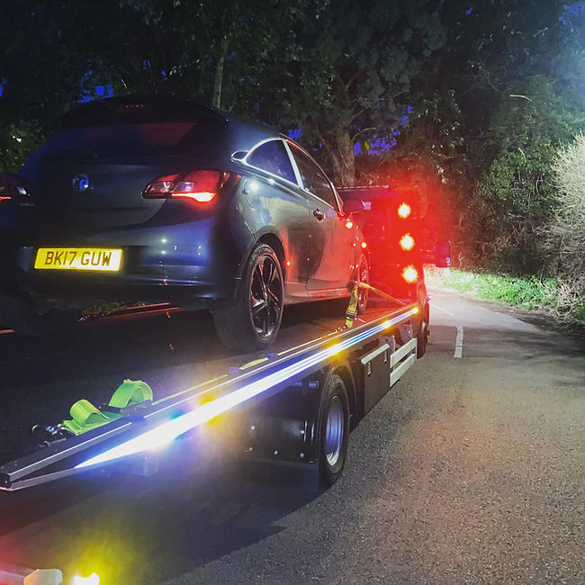 car being recovered at night