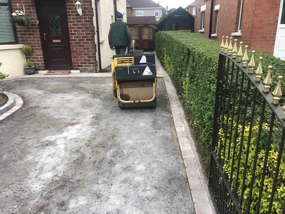 Compact roller being used to create a new driveway