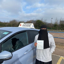 learner driver holding test pass certificate