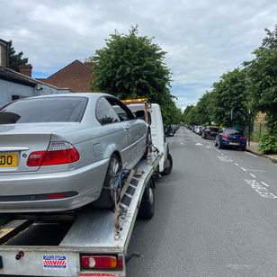 silver car being recovered